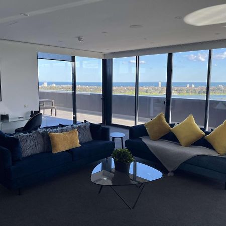 The Kinson Hotel Melbourne Exterior photo The living room of a three-bedroom apartment at The Beacon